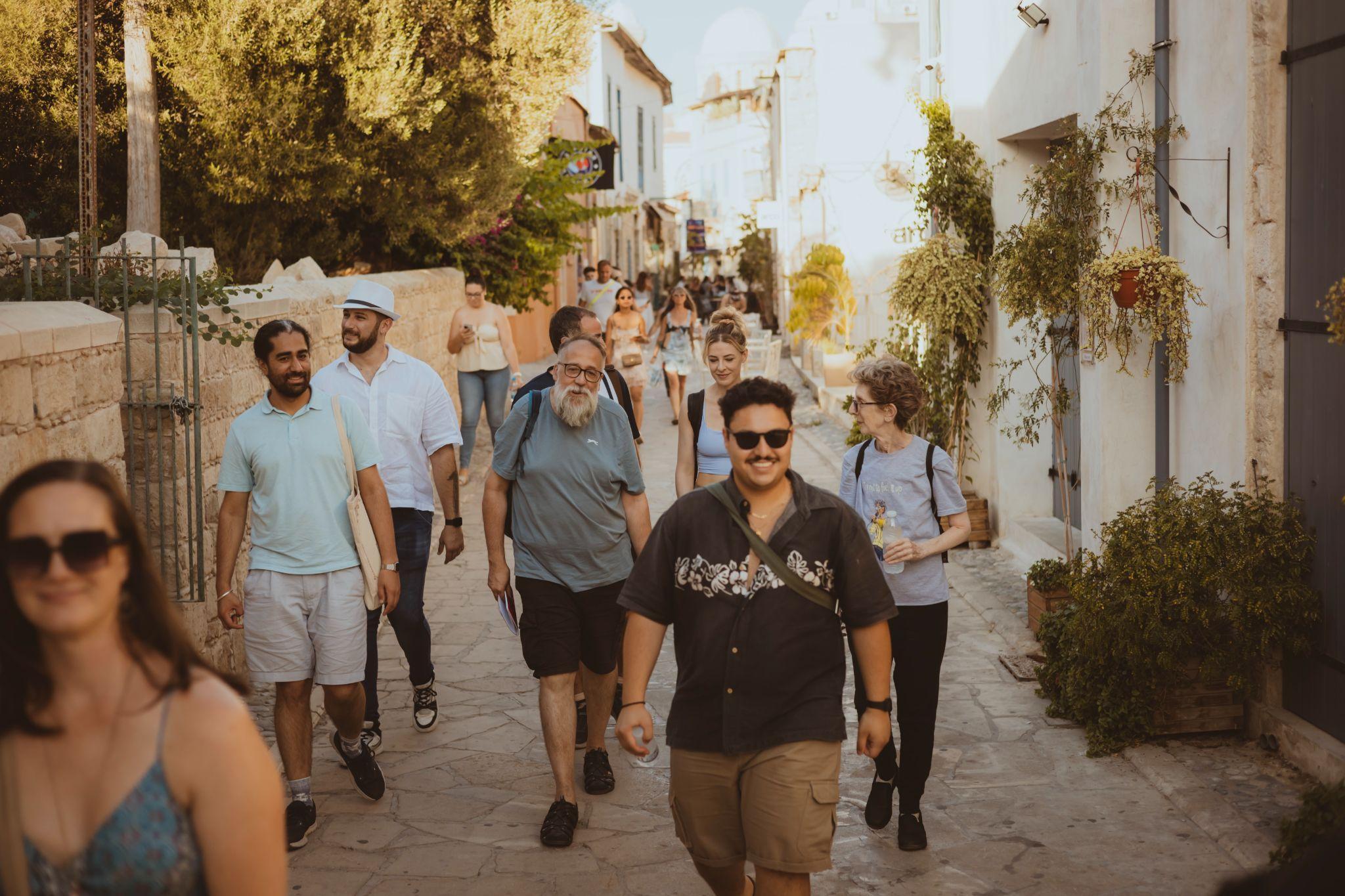 Artists and festival team walking through Limassol old town